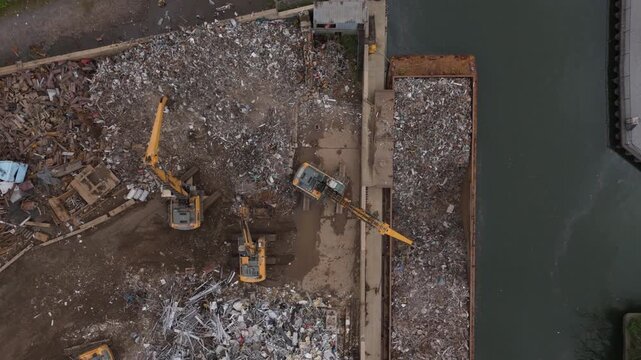 descending towards metal scrapyard in Brooklyn