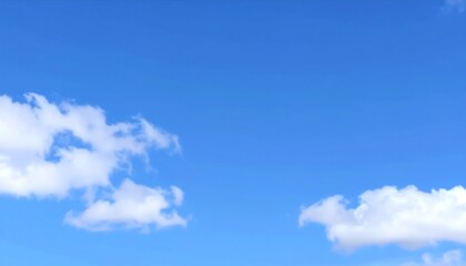 Fototapeta premium Clear blue sky with puffy white clouds