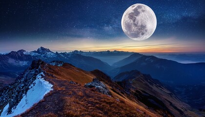 majestic mountain range illuminated by bright yellow glow with waves of water in the foreground