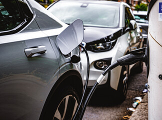 EV Public Charging Station On Street, Electric Vehicle Plugged In Charge Port Door, Electric Car...