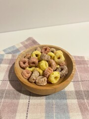 colorful fruit cereal in a wooden bowl