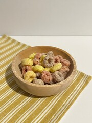 colorful fruit cereal in a wooden bowl