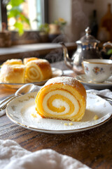 Delicious Sweet Swiss Roll Slices with Powdered Sugar and Tea