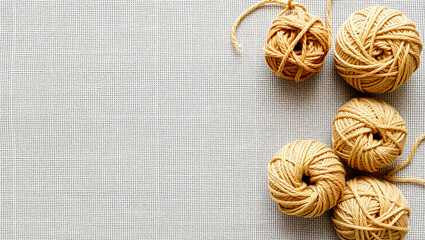 Minimalist Yarn Ball Arrangement in Top-Left Corner on Textured Linen – Natural Colors and Wide Blank Area Ideal for Background or Template