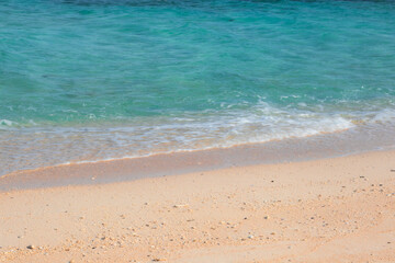 Waves Washing Ashore on a Sandy Beach