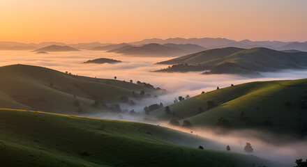 Tranquil sunrise illuminates misty valleys and rolling hills in a scenic landscape