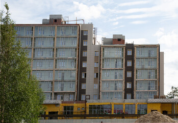 Construction of a new apartment  building in the city of Noyabrsk in summer
