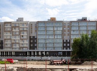 Construction of a new apartment building in the city of Noyabrsk  in summer