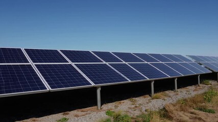 In this striking video, a row of solar panels glistens under the bright sun, showcasing the efficiency of harnessing renewable energy and paving the way toward a sustainable future. 