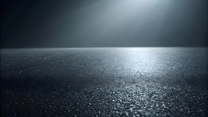 Dark textured surface with dramatic light beam across horizon