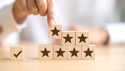 Hand adding a star to wooden blocks, symbolizing customer satisfaction or rating.