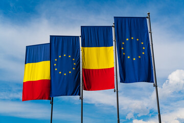 National flag of Romania and European flag in Cluj-Napoca, Romania