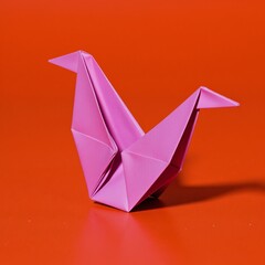 Fototapeta premium Cool Digital illustration of a purple origami bird against an orange background