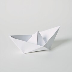 Cool origami paper boat skillfully crafted from a single white sheet and featuring sharp folds and balanced symmetry evokes feelings of fragility minimalism and nostalgic childhood wonder