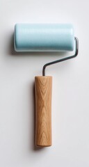 Light blue paint roller on a white background