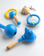 Colorful baby toys arranged on a white background