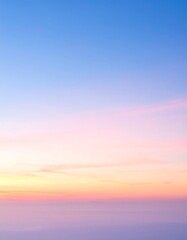 Smooth pastel sky gradient from blue to pink, orange, and purple at horizon.