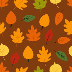 Obraz premium Seamless pattern of colorful autumn leaves on a brown background