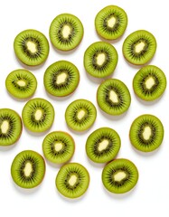Fototapeta premium An overhead shot of numerous round kiwi slices arranged on a white background