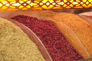 Vibrant spices displayed in a market setting