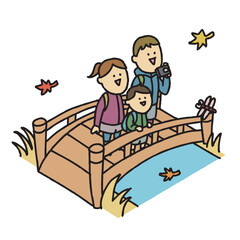 ハイキングで紅葉を楽しむ家族