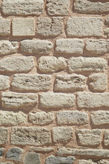 Historical wall of weathered stone in rustic setting