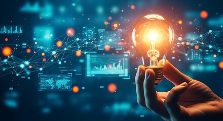 Human hand holding a brightly glowing light bulb, emanating warm light amidst a complex blue digital network with abstract data displays.