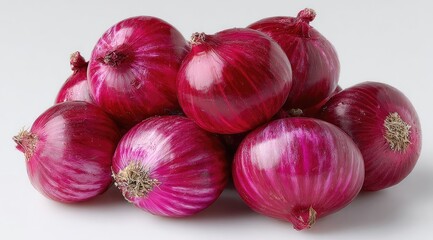 A pile of fresh, vibrant red onions