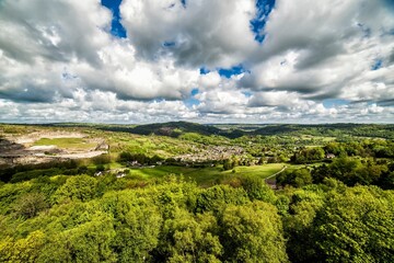 Lush Green Valley with Rolling Hills and Vibrant Cloudscape