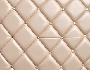 Cream leather upholstery with diamond tufting and metallic studs