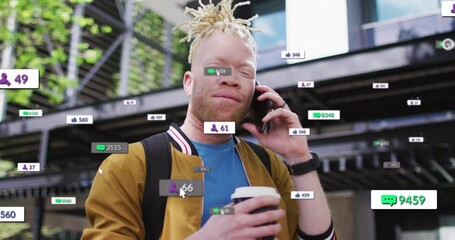 Man placing smartphone against ear while animated social media metrics climbing tracking engagement - Powered by Adobe