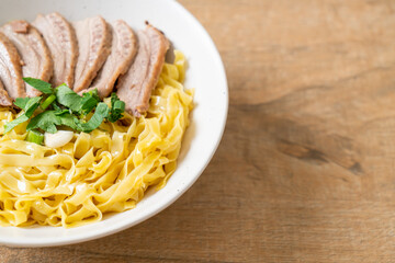 dried duck noodles in white bowl