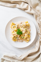 tortellini pasta with mushroom cream sauce and cheese