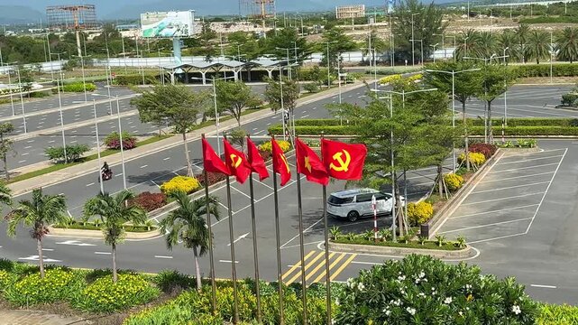 Vietnam, Nha Trang - 05.07.2025 - Red flag of Vietnam, yellow star on a red background. Socialism, sickle and hammer on the flag, USSR banner, ideology communism, Cam Ranh airport