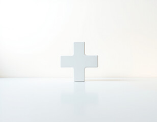 White Cross Symbol on Reflective Surface plus sign