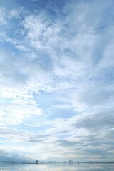 Fototapeta premium Light sky, soft clouds, hazy horizon