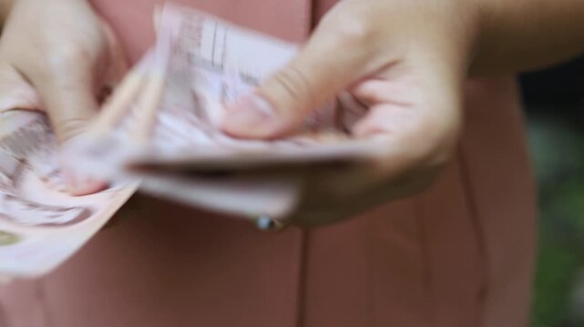 Thai Baht Money Count, Close-up Thai Baht Banknotes in Hand, Business hands Counting Money, Money and financial concepts