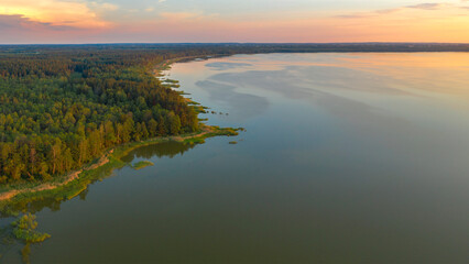 a large lake in a summer forest