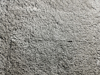 Textured exterior wall, rough grey cement surface, copy space