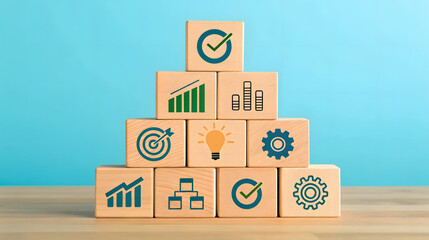 Fototapeta premium Wooden cubes stacked in pyramid with business icons