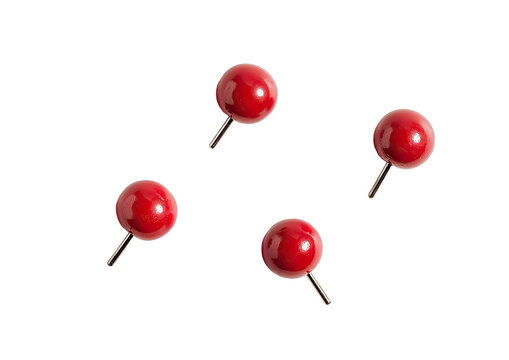 Four small, round, glossy, red pushpins against a black background