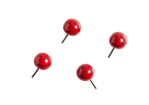 Four small, round, glossy, red pushpins against a black background