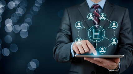 Professional expertly manages digital documents and team collaboration on a tablet.