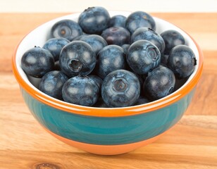 Fresh blueberries in a ceramic bowl showcasing vibrant colors and textures for culinary inspiration and healthy snacking