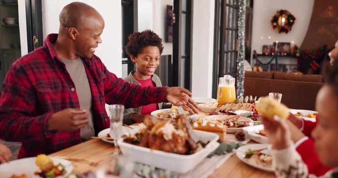 Happy family, christmas and dining with food at table for festive feast, meal or lunch together. Parents, children and eating with kids for gathering celebration, december holiday or reunion in home