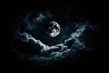 Full moon shrouded by dark, ominous clouds
