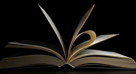 Open Book with Heart-Shaped Page on Dark Background, Symbolizing Love for Reading and Knowledge