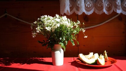 Still Life with Flowers and Melon A Rustic Composition