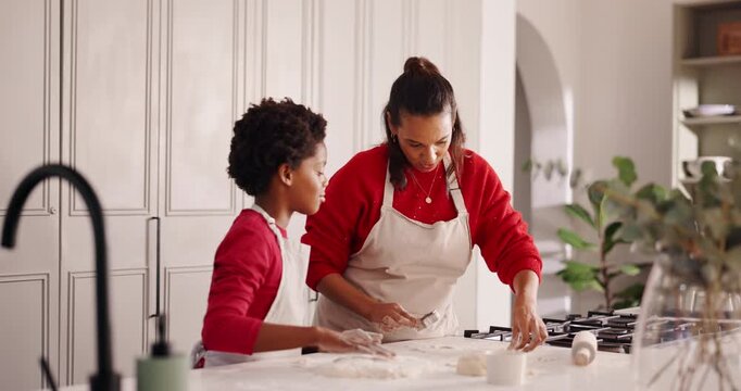 Baking, teaching and mom with kid in kitchen for bonding with preparing pastry for cookies. Happy, learning and mother with boy child for cooking food together with development in family home.