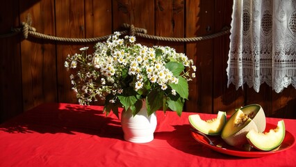 Still Life with Flowers and Melon A Rustic Composition